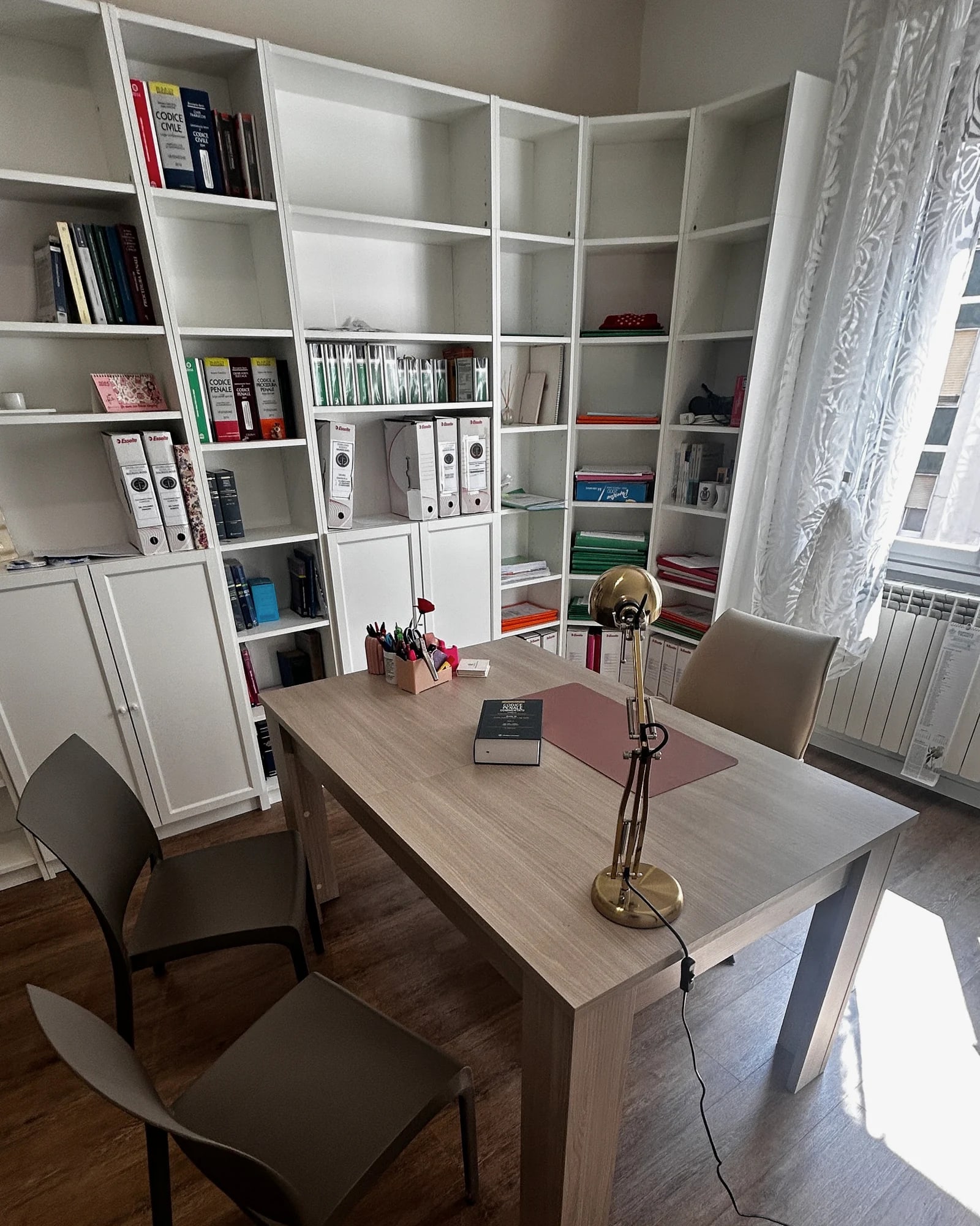 Attorney Francesca Fumarulo’s office with desk and bookcase